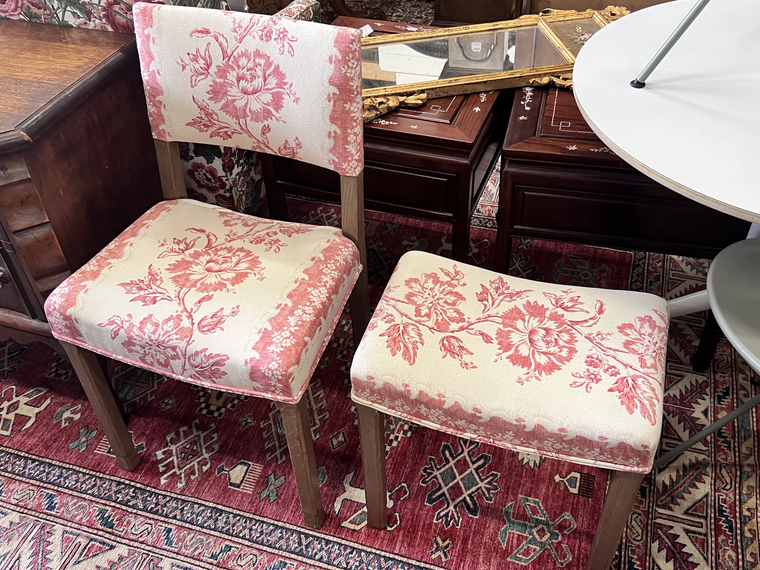 A reupholstered Coronation chair , the back applied with a George VI fabric remnant and an Elizabeth II Coronation stool